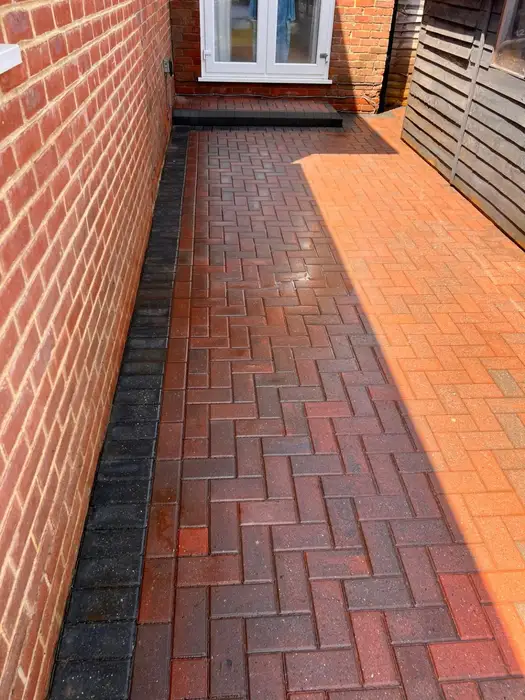 Clean red herringbone block paving path